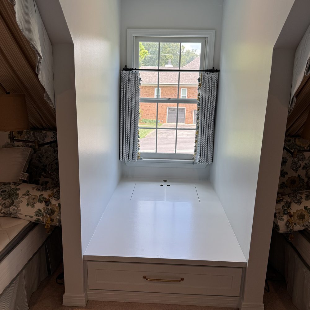 Built-in window seat with hidden storage drawer